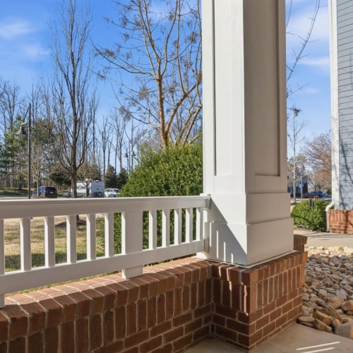 a white railing and a white building