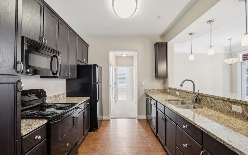 a kitchen with black appliances