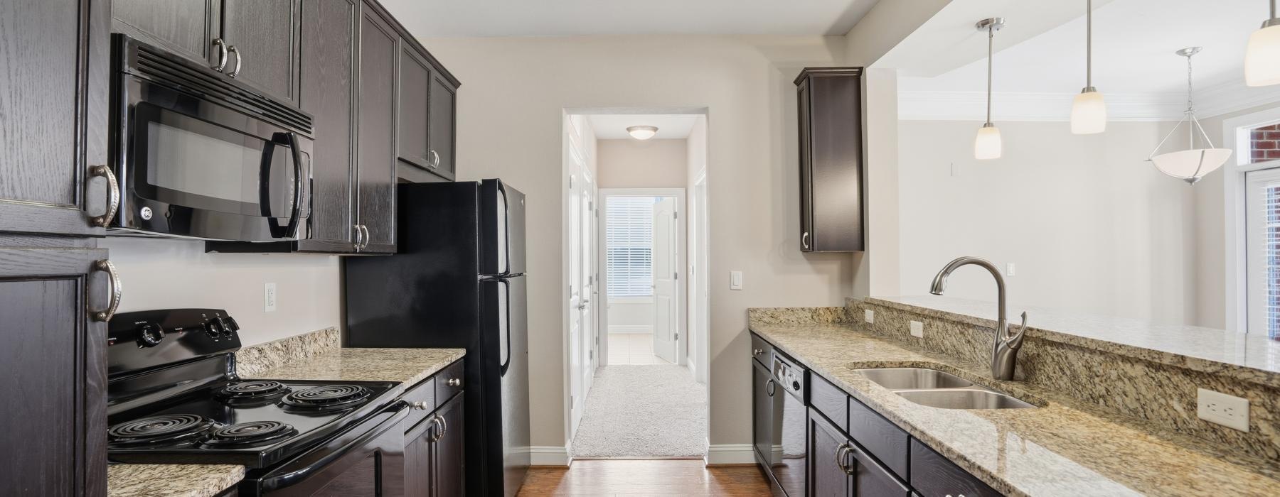 a kitchen with black appliances
