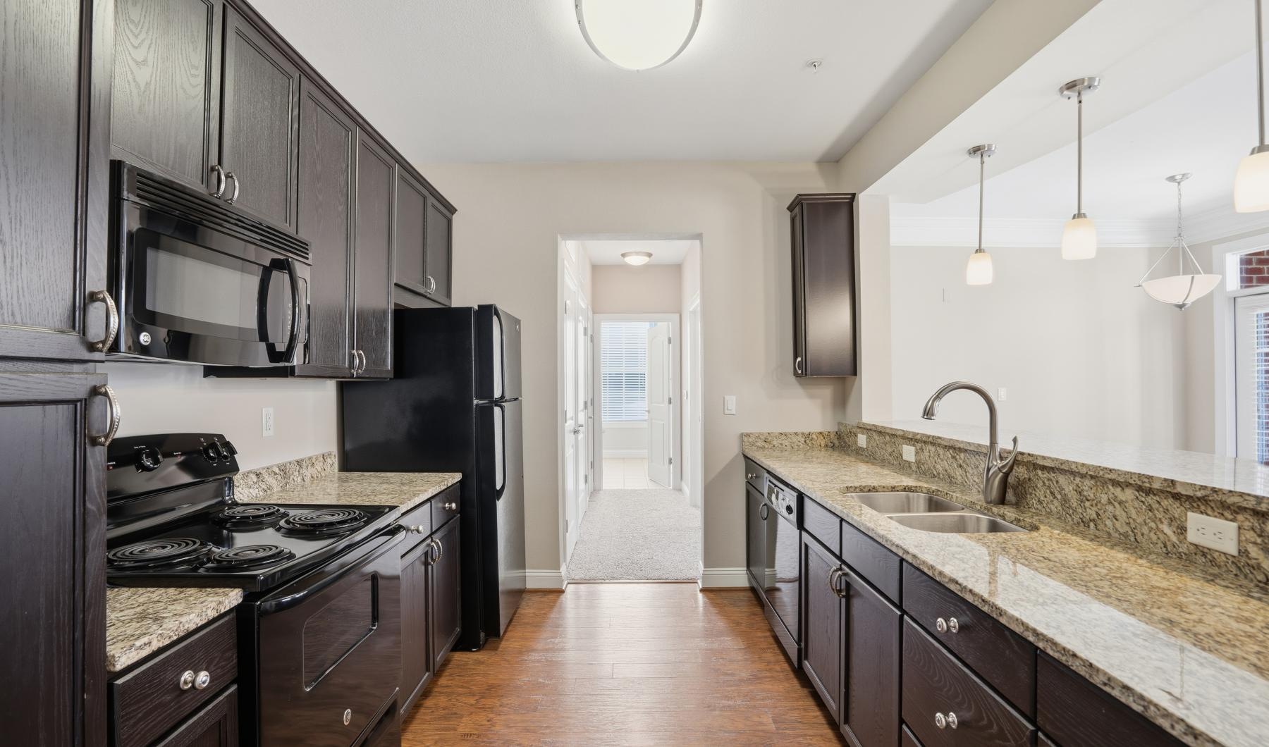 a kitchen with black appliances