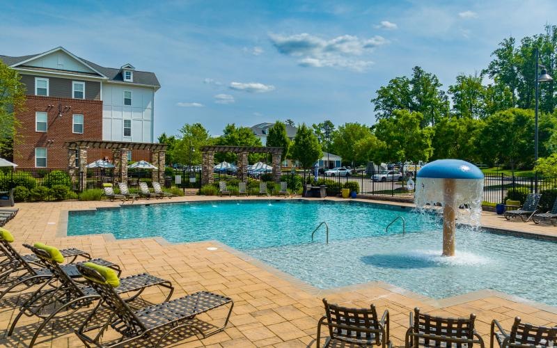 a pool with chairs around it