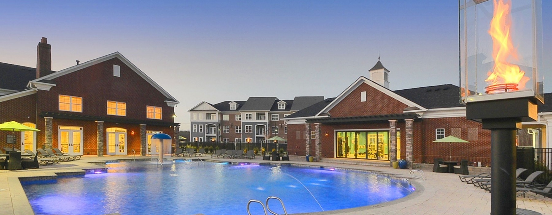 Resort-style swimming pool with lounge seating