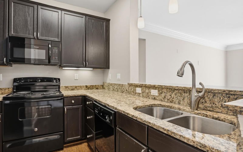 a kitchen with black appliances
