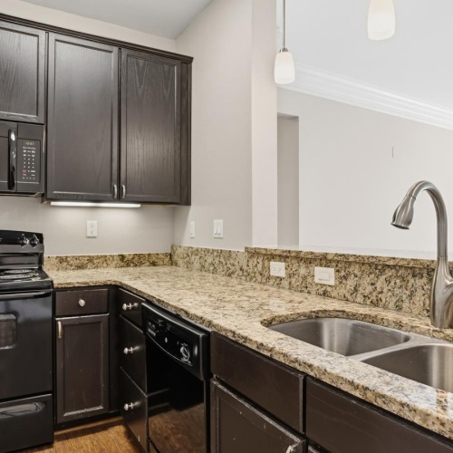 a kitchen with black appliances